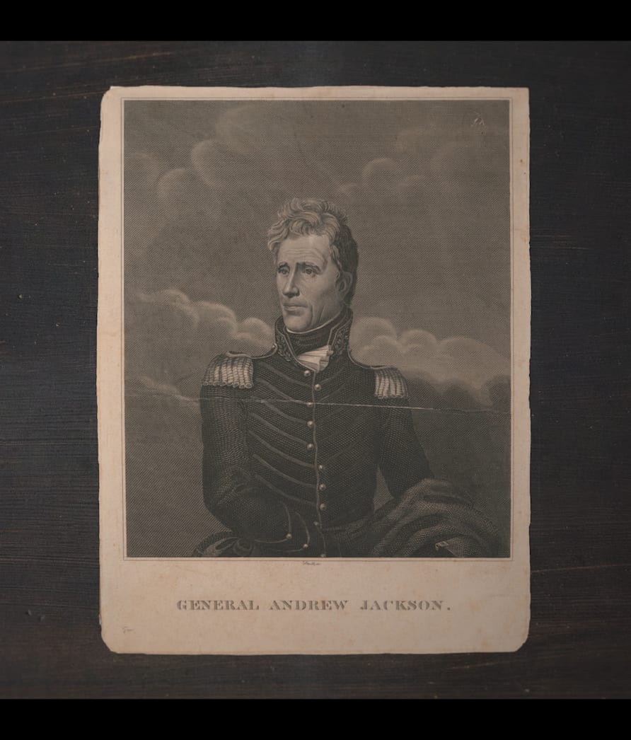 Archive engraving of General Andrew Jackson on a dark wooden surface